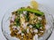 Hurda, Tender Jowar or Sorghum Bhel served in a bowl with green chilly and lemon. Selective focus