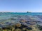 Hurghada, Egypt - October 1, 2021: Beautiful view of the coral reef and floating yachts in the red sea at low tide. Copy space