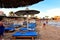 HURGHADA, EGYPT - OCTOBER 14, 2013: Sandy beach full of people is on the Red Sea coastline. Luxury resort hotel on Red Sea beach t