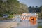 Hurricane Ian flooded street with road closed signs blocking driving of cars. Safety of transportation during natural