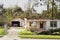 Hurricane Laura. Destruction from strong winds. House without a roof, garage without a door. Louisiana, USA