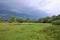 hurricane sky black clouds rain meadow storm field trees summer overcast