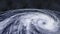 Hurricane storm tornado over the Earth from space, satellite view.