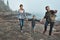 Hurry lets go this way. a cheerful young family holding hands and walking together next to the ocean outside during the