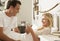 Husband Bringing Wife Hot Drink In Bed At Home