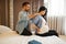 Husband doing massage to his pregnant wife at home