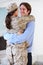 Husband Greeting Military Wife Home On Leave