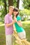 Husband hold hands of wife near braided straw