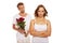 Husband offering roses to unhappy wife