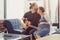 Husband with pregnant wife stay home lovely playing guitar music for baby kissing and showing love together