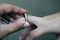 Husband putting a gold ring on his wife during the wedding