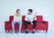 Husband quarrel with wife conflict and boring couple on red sofa,Negative emotions