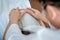 Husband uses hand to touch belly of pregnant wife in white dress, with soft sunlight In morning relaxed atmosphere,concept