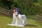 Husband and wife kiss on their wedding Day outdoors