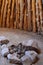 Hut interior with rocks fire pit