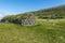 The hut for sheep shearing and Kirkjubour Village at background