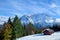 Hut on snow meadow in winter Alps