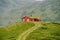 Hut wooden mountain huts in mountain pass Norway. Norwegian landscape with typical scandinavian grass roof houses. Mountain