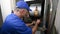 HVAC Technician Checking Voltage on a Wiring Harness