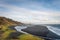 Hvitserkur rock formation in Iceland volcanic column standing along black beach and overgrown cliffs