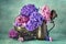 Hyacinth flowers in a copper pitcher