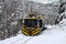 Hybrid locomotive in snow. Passenger train, mountain rail. Hungarian forest railway at winter.