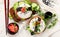 Hybrid modern food. Sushi burger with salmon, white rice, avocado, cucumber