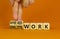 Hybrid or onsite work symbol. Businessman turns cubes and changes words `onsite work` to `hybrid work`. Beautiful orange