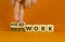 Hybrid or remote work symbol. Businessman turns cubes and changes words `remote work` to `hybrid work`. Beautiful orange