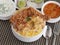 Hyderabad Chicken Dum biryani with korma, curd chutney