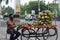 Hyderabad, Telangana, India. july-06-2020: a man sells coconuts on the road, wearing mask, corona pandemic, street market