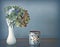 Hydrangea flower in vase and candle