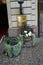 Hydrangea macrophylla, Dichondra argentea, Anemone hybrida and ornamental grasses grow in decorative vases in September.
