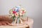 Hydrangea rich bouquet. Vintage floristic background, colorful roses, antique scissors and a rope on an old wooden table