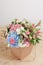 Hydrangea rich bouquet. Vintage floristic background, colorful roses, in crafting the package on the wooden table