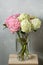 Hydrangeas in a glass vase. Hydrangeas produce larger mop heads made up of clusters of small flowers from Summer through