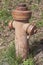 Hydrant on a field in vintage look