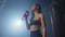 Hydration Break: Fitness Enthusiast Quenches Thirst After Intense Boxing Session