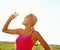 Hydration is important when faced with rigorous excercise. A beautiful young woman in sportswear drinking water from a