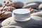 Hydration station skincare moisture container placed on smooth white rock surface