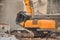 Hydraulic excavator works with debris at demolition site