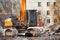 Hydraulic excavator works with debris at demolition site