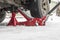 Hydraulic Trolley Jack Car Lift and Jack stand for changing car wheels. Replacing wheel in winter on snowy road in snowfall