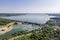 Hydroelectric dam with flowing green water through gate