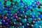 Hydrogel Orbeez background.multicolored orbiz texture.Blue green orbiz balls in water.Hydrogel balls for decoration