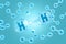 Hydrogen molecules floating in the air on blue background. 3d illustration