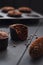 Hygge cozy dessert. Half eaten tasty chocolate muffins with small chocolate chips on dark background