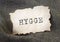 Hygge word inscription on craft paper