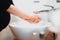 Hygiene and disinfection of hands at home. pregnant woman with baby boy, caucasian people