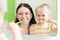 Hygiene. Happy mother and child brushing teeth